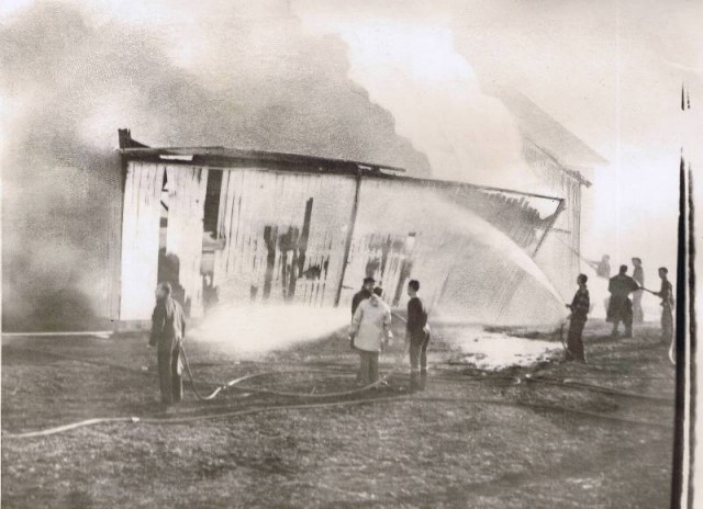 DCFD extinguishes a small barn fire on the Langworthy Farm. The barn was in the path of a 60 acre brush fire that started on Stuart St. and swept to Shore Rd.  on March 25, 1962. Photo courtesy of the Westerly Sun.